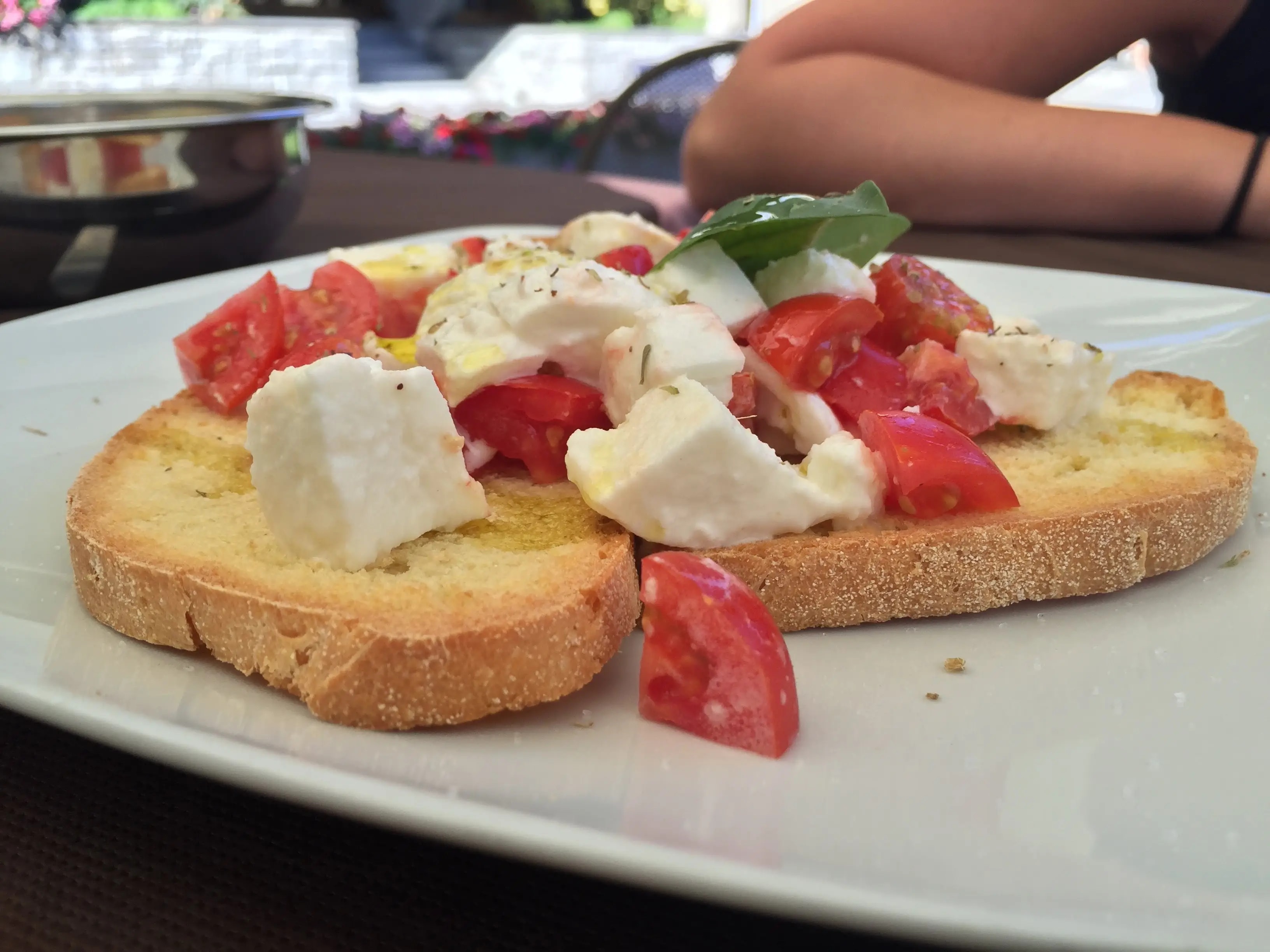 Close-up of bruscetta topped with fresh tomatoes and basil Close-up of bruscetta topped with fresh tomatoes and basil