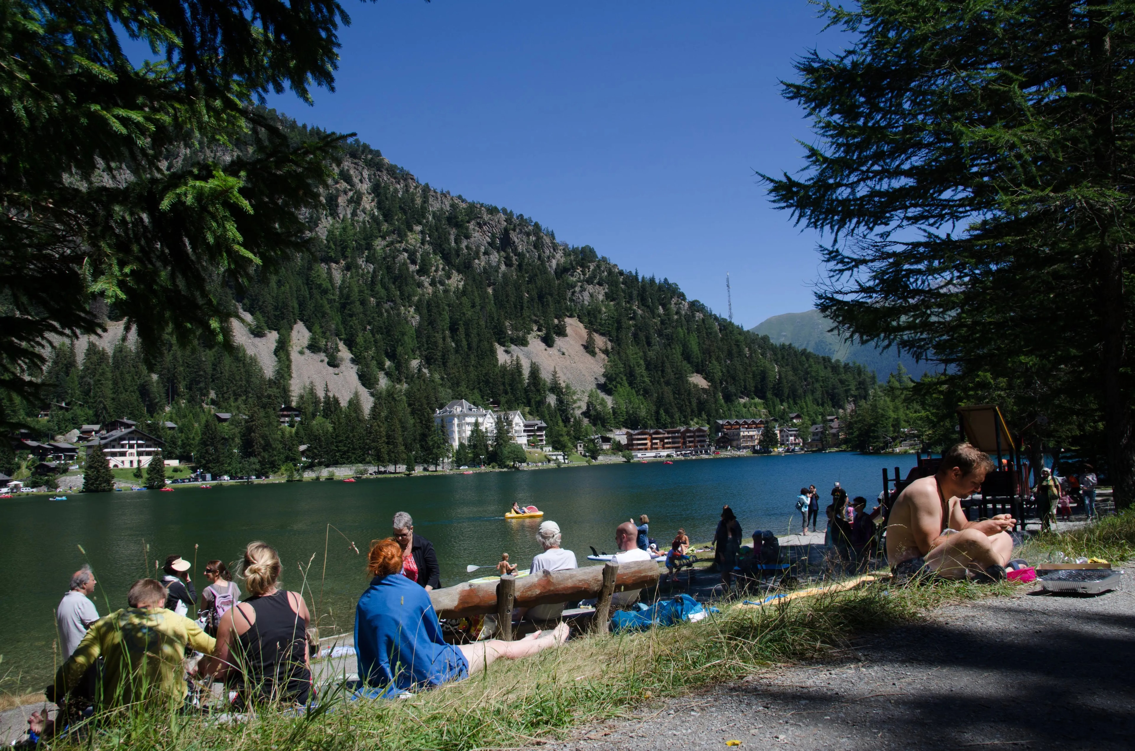A lakeside beach area at Champex-Lac popular with hikers on rest days A lakeside beach area at Champex-Lac popular with hikers on rest days