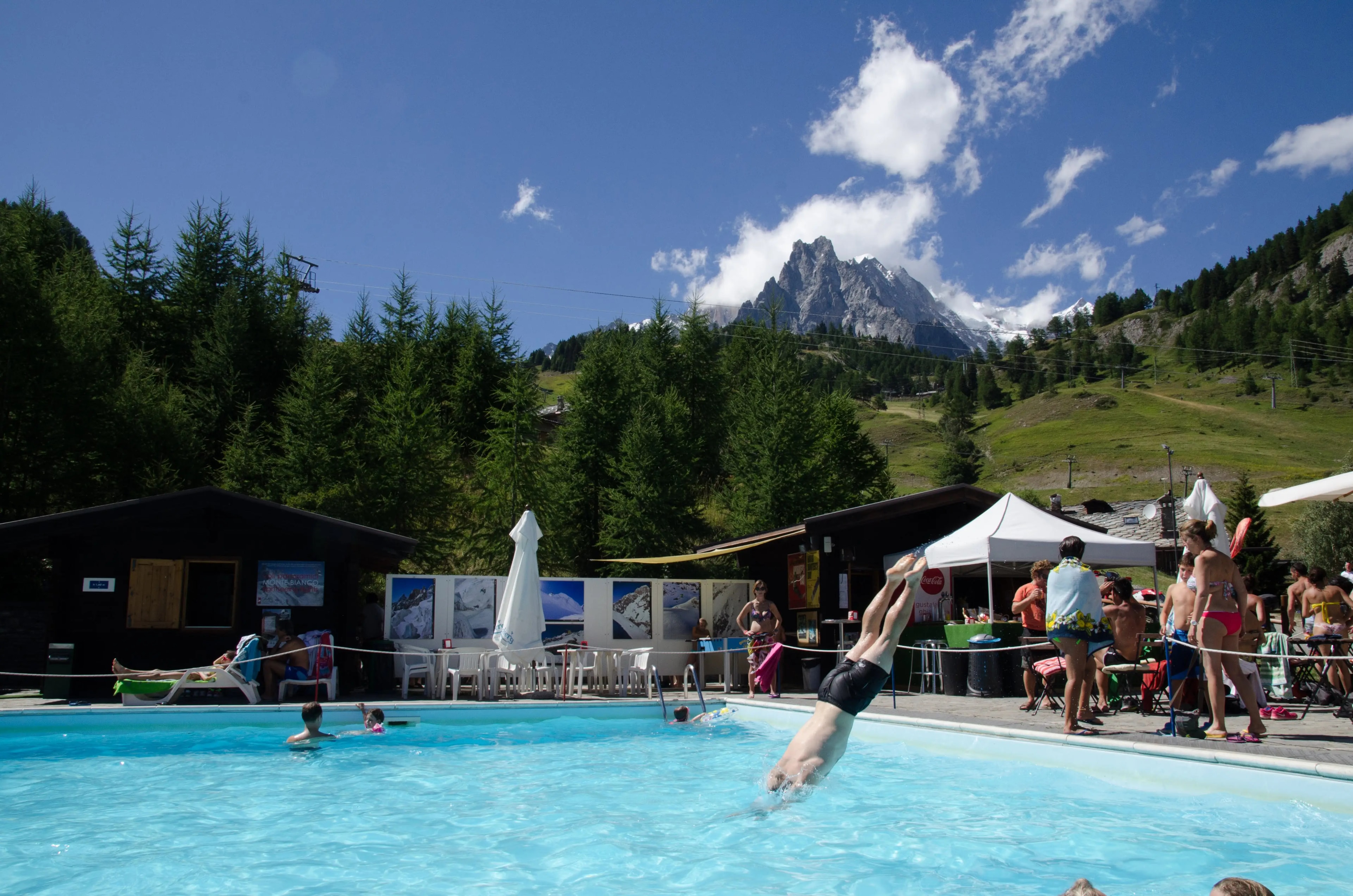 An outdoor hotel pool with mountain views in the Chamonix valley An outdoor hotel pool with mountain views in the Chamonix valley