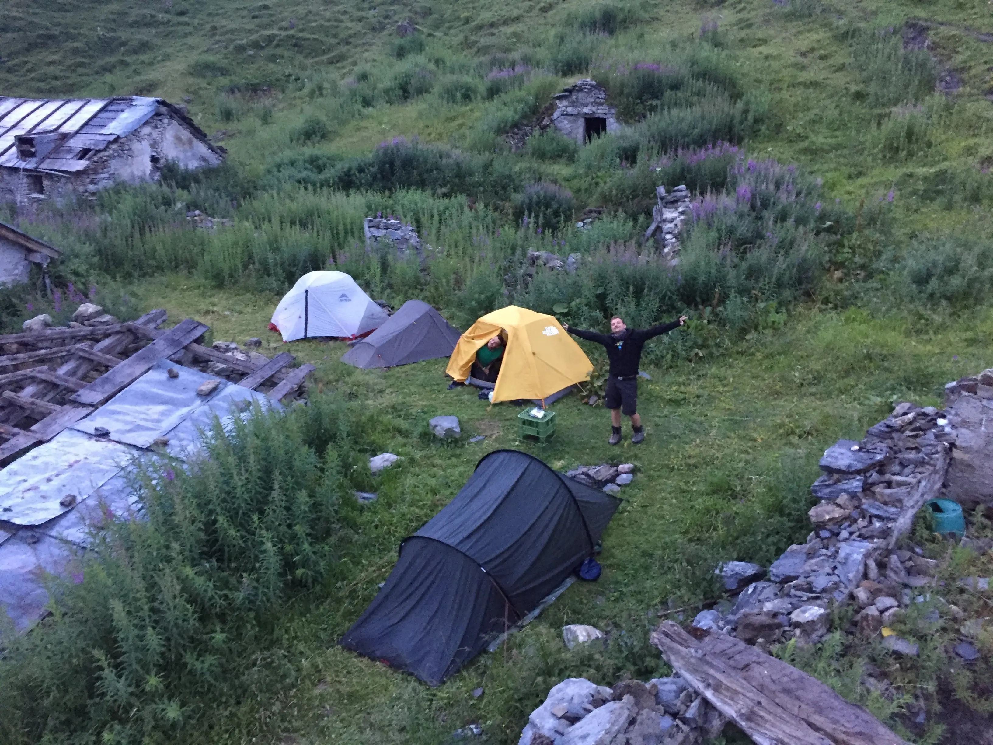 A small camp setup in alpine meadow near Refugio Bonatti in Val Ferret A small camp setup in alpine meadow near Refugio Bonatti in Val Ferret