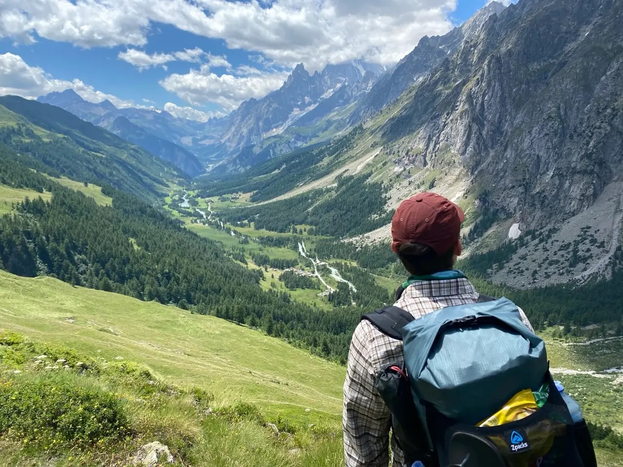The Val Ferret valley with green pastures and glacier-capped peaks above Refugio Bonatti The Val Ferret valley with green pastures and glacier-capped peaks above Refugio Bonatti